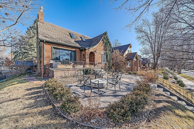 rear view of house featuring a patio