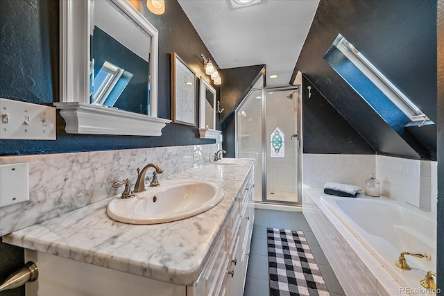 bathroom featuring vanity, tile patterned flooring, plus walk in shower, and vaulted ceiling