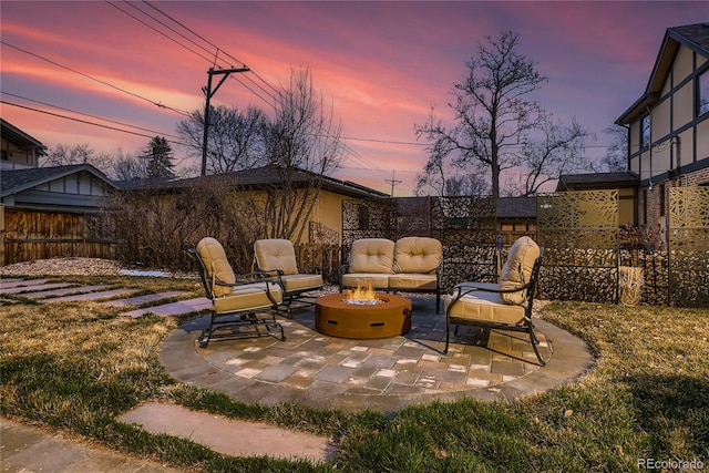 patio terrace at dusk with an outdoor fire pit