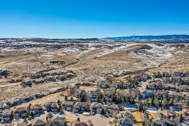 birds eye view of property featuring a mountain view and a residential view