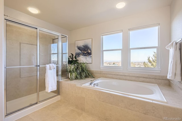 bathroom with a bath and a shower stall