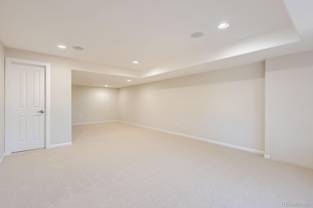 finished basement featuring recessed lighting, baseboards, and light carpet