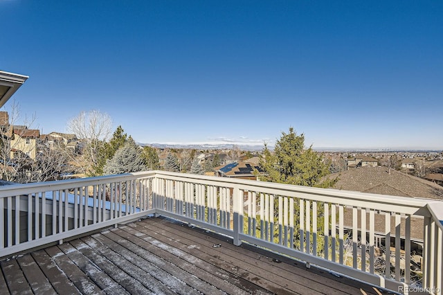 wooden terrace featuring a residential view