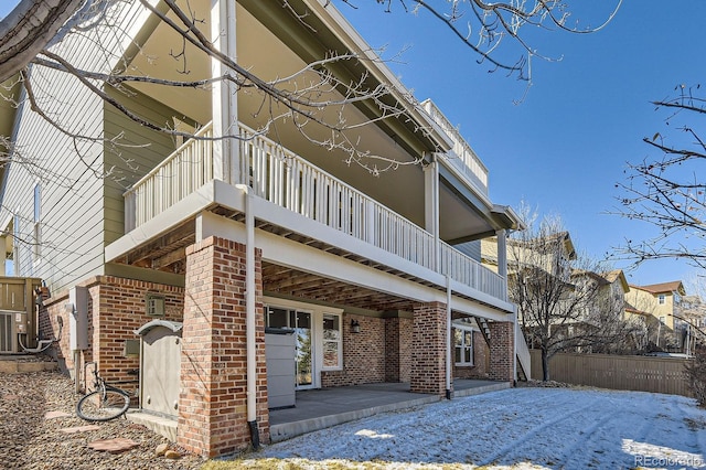 view of side of home featuring brick siding