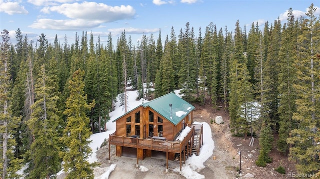 585 Miners Way, Fairplay, CO 80440 - back of house featuring log veneer siding, a garage, a forest view, and a deck