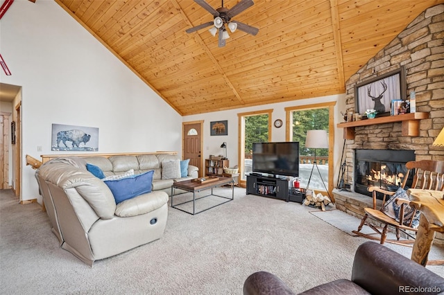 585 Miners Way, Fairplay, CO 80440 - carpeted living room with wood ceiling, high vaulted ceiling, ceiling fan, and a stone fireplace