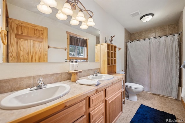 585 Miners Way, Fairplay, CO 80440 - bathroom featuring toilet, double vanity, curtained shower, and tile patterned floors