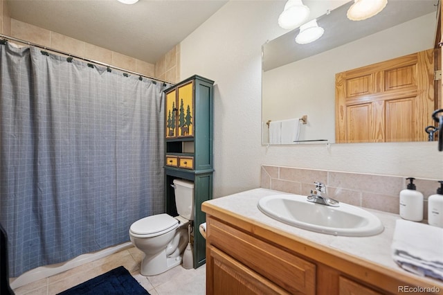 585 Miners Way, Fairplay, CO 80440 - bathroom with toilet, vanity, tile patterned flooring, and shower / bathtub combination with curtain