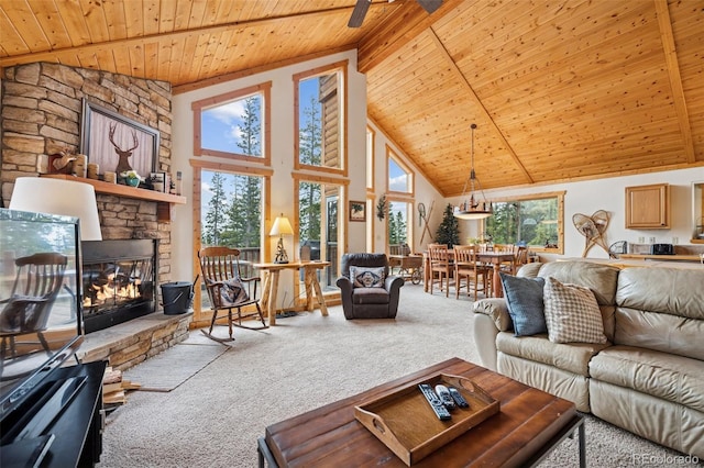 585 Miners Way, Fairplay, CO 80440 - carpeted living area with wood ceiling, beamed ceiling, high vaulted ceiling, and a fireplace