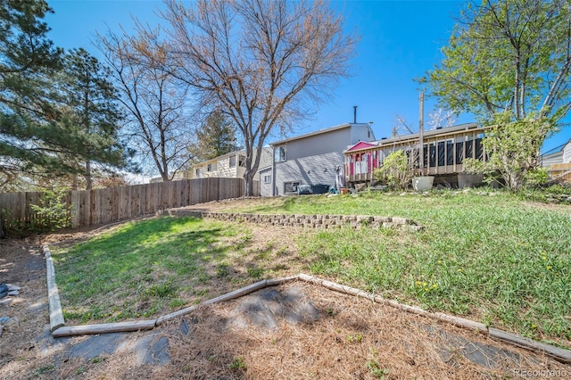 view of yard with a sunroom and fence