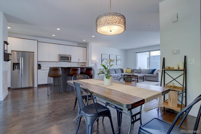 dining space featuring dark hardwood / wood-style floors