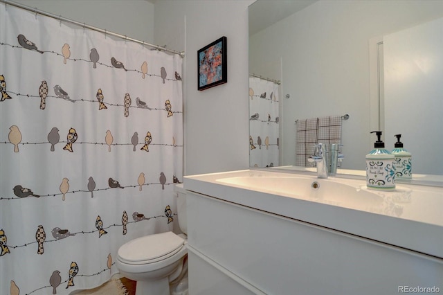 bathroom with vanity and toilet