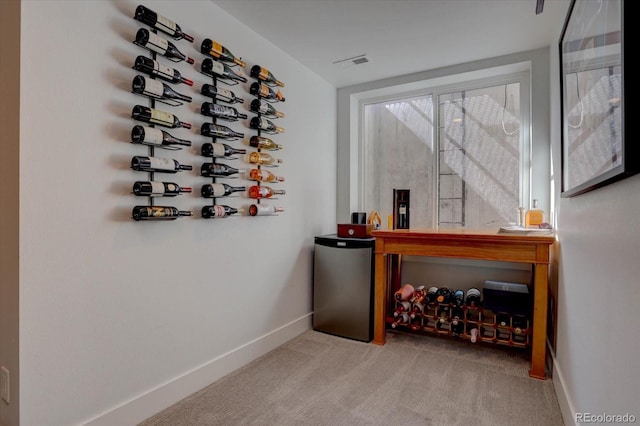 wine room featuring light carpet