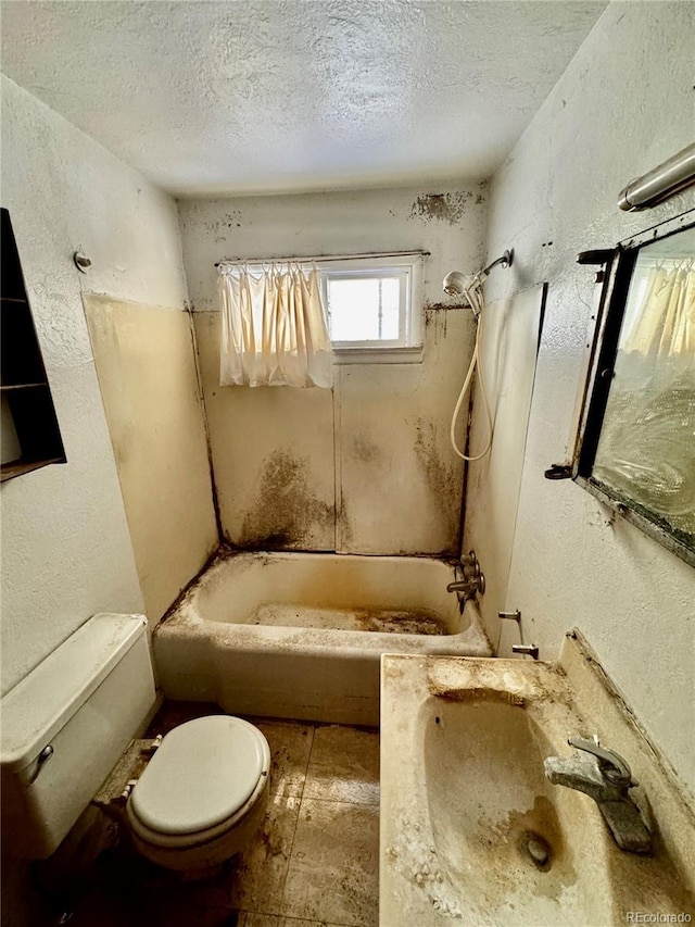 bathroom featuring toilet, shower / washtub combination, a textured ceiling, and a textured wall