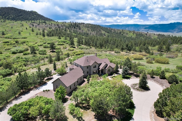 drone / aerial view featuring a mountain view