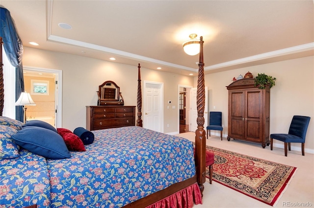 carpeted bedroom with a closet and ensuite bath