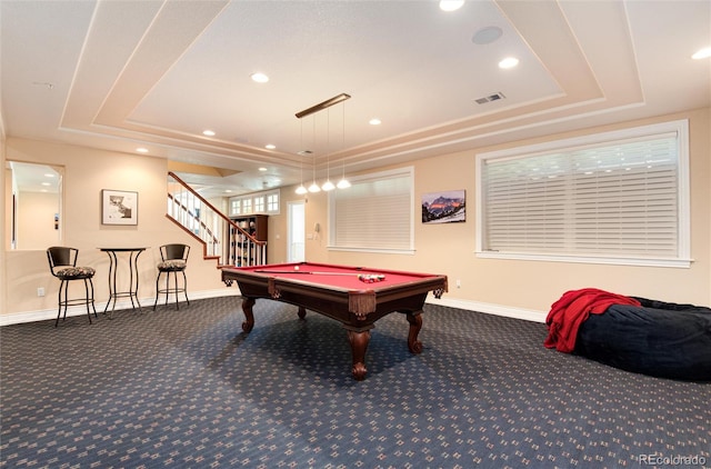 game room featuring dark colored carpet, a raised ceiling, and pool table