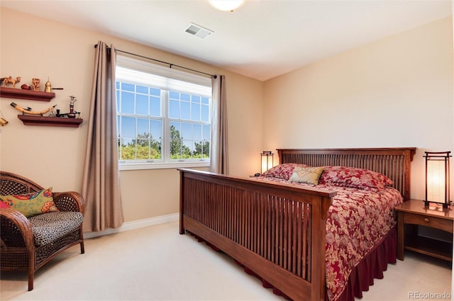 bedroom featuring light colored carpet