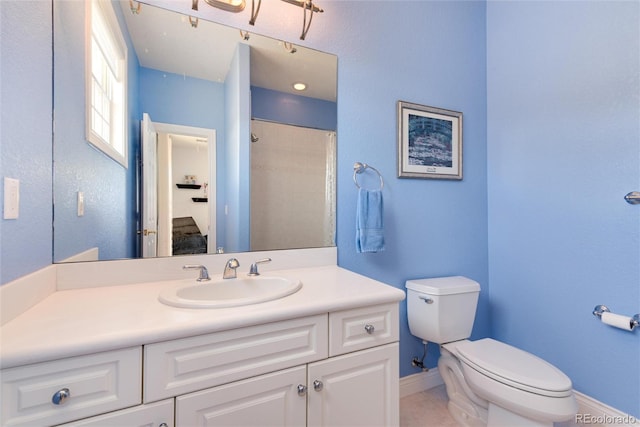 bathroom featuring walk in shower, tile patterned flooring, vanity, and toilet