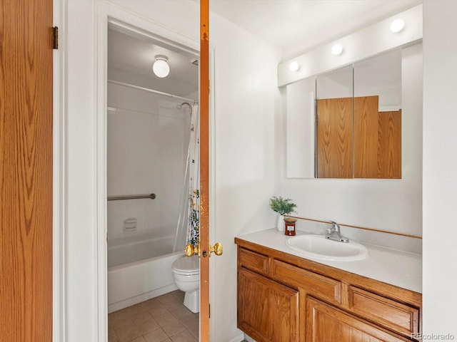 bathroom with tile patterned floors, toilet, vanity, and shower / bath combo with shower curtain