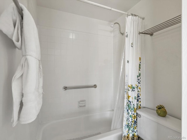 bathroom featuring toilet and shower / tub combo with curtain