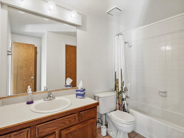 bathroom featuring tile patterned floors, shower / tub combo, toilet, and vanity