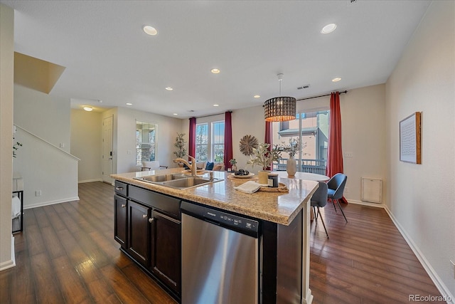 kitchen with a sink, dark wood-style floors, baseboards, and dishwasher