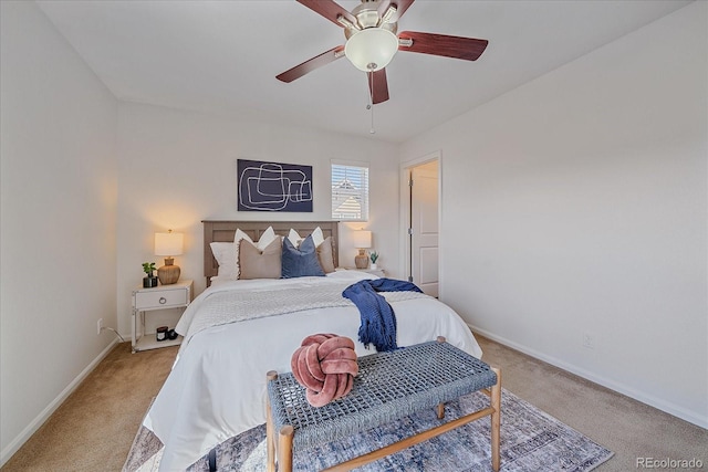 bedroom featuring light carpet, ceiling fan, and baseboards