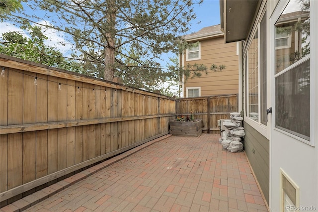 1409 Carlyle Park Cir, Highlands Ranch, CO 80129 - fenced backyard with a patio area