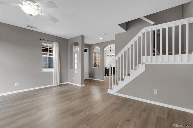 1409 Carlyle Park Cir, Highlands Ranch, CO 80129 - foyer with healthy amount of natural light, a ceiling fan, wood finished floors, stairway, and recessed lighting