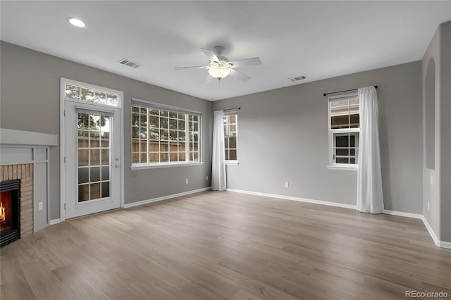 1409 Carlyle Park Cir, Highlands Ranch, CO 80129 - unfurnished living room featuring ceiling fan, wood finished floors, a fireplace, and recessed lighting