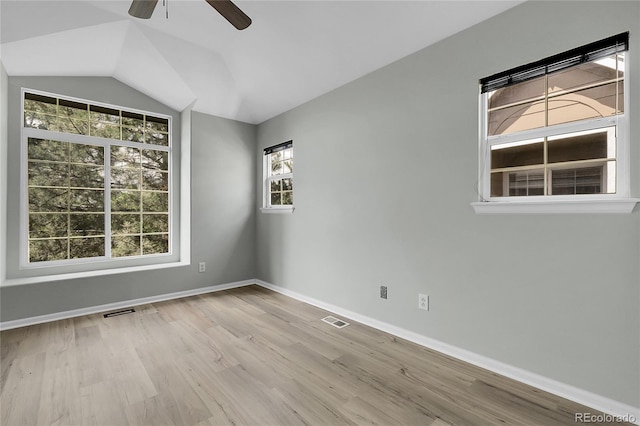1409 Carlyle Park Cir, Highlands Ranch, CO 80129 - spare room with a ceiling fan, wood finished floors, and vaulted ceiling