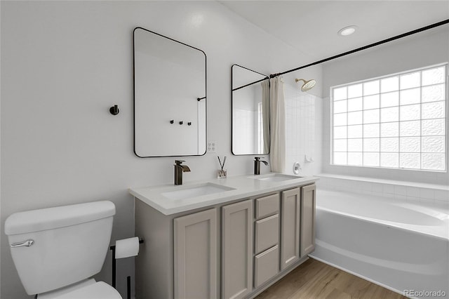 1409 Carlyle Park Cir, Highlands Ranch, CO 80129 - full bathroom with double vanity and wood finished floors