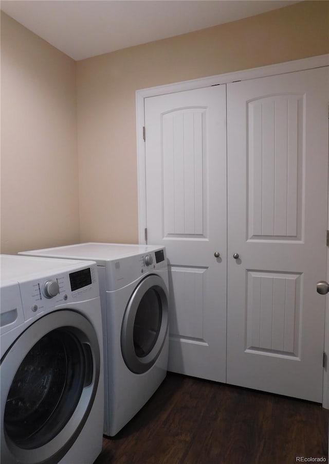 washroom featuring laundry area, independent washer and dryer, and dark wood finished floors