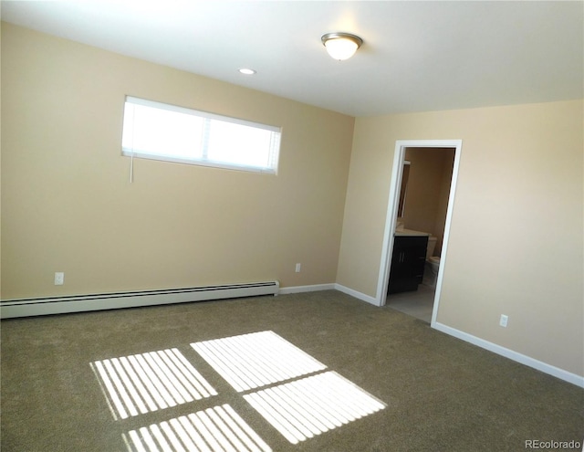 carpeted spare room featuring baseboards, a baseboard heating unit, and recessed lighting