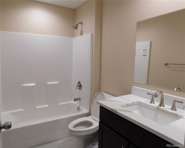 bathroom featuring toilet, tile patterned floors, vanity, and shower / bathing tub combination