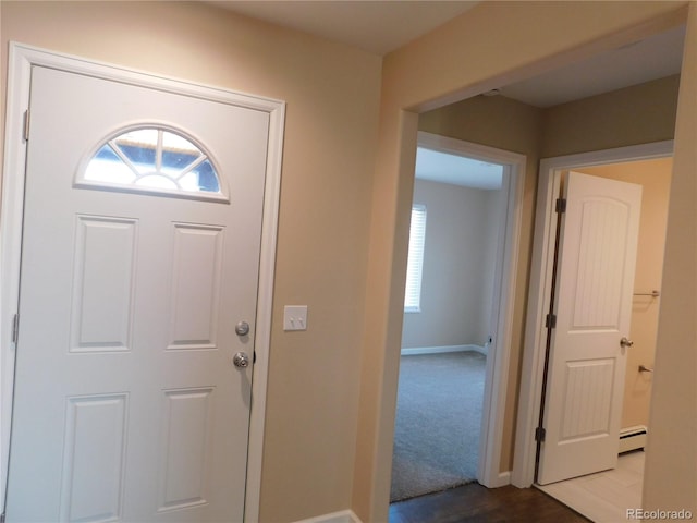 entryway featuring baseboard heating and baseboards