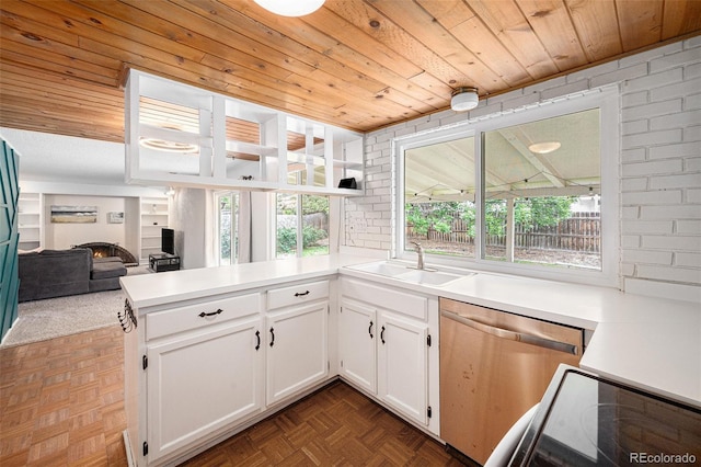 3756 S Mission Pkwy, Aurora, CO 80013 - kitchen with dishwasher, a sink, wooden ceiling, white cabinetry, and a peninsula
