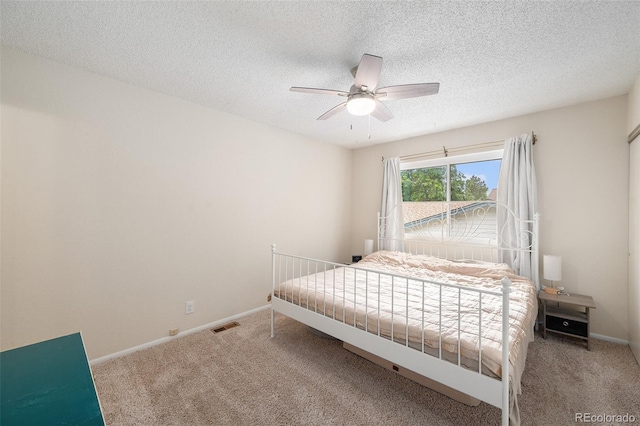 3756 S Mission Pkwy, Aurora, CO 80013 - bedroom featuring carpet floors, baseboards, a ceiling fan, and a textured ceiling