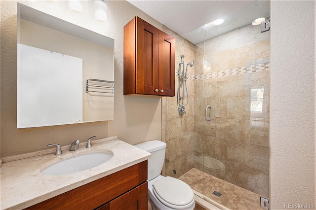 3756 S Mission Pkwy, Aurora, CO 80013 - bathroom featuring toilet, a shower stall, vanity, and a textured wall