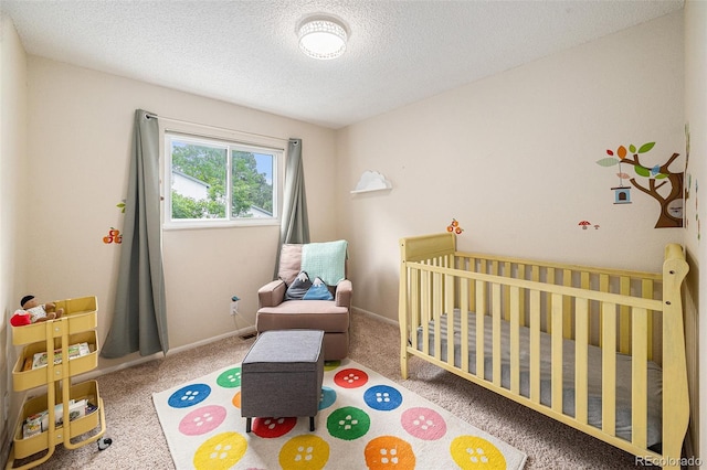 3756 S Mission Pkwy, Aurora, CO 80013 - bedroom with a nursery area, a textured ceiling, carpet floors, and baseboards