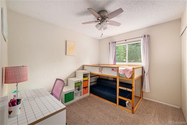 3756 S Mission Pkwy, Aurora, CO 80013 - bedroom featuring carpet flooring, a textured ceiling, a ceiling fan, and baseboards