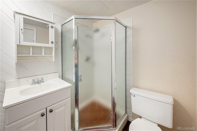 3756 S Mission Pkwy, Aurora, CO 80013 - bathroom featuring vanity, toilet, and a shower stall
