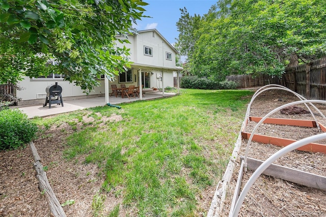 3756 S Mission Pkwy, Aurora, CO 80013 - view of yard featuring a patio and a vegetable garden