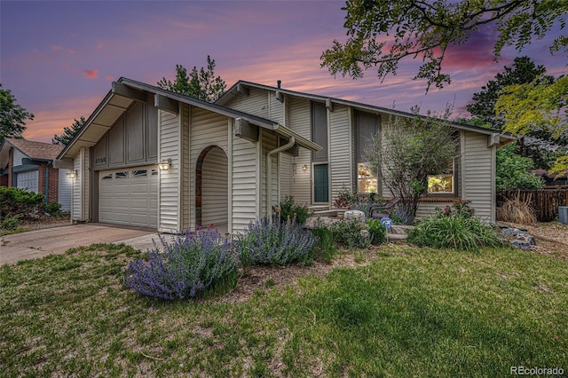 3756 S Mission Pkwy, Aurora, CO 80013 - mid-century inspired home with an attached garage, driveway, a front lawn, and central AC unit