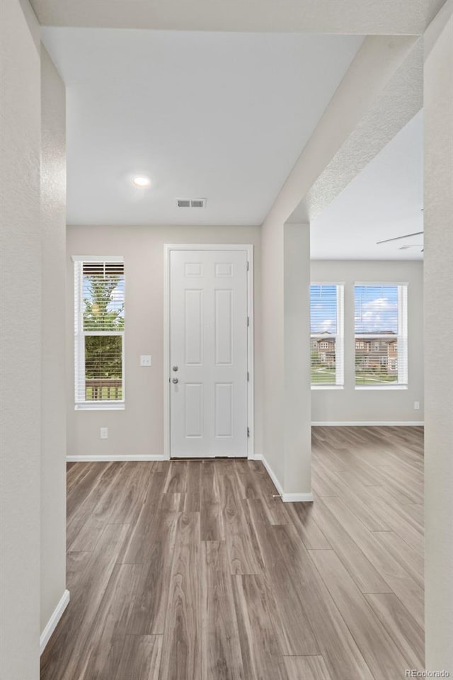 13870 Ash Cir, Brighton, CO 80602 - foyer featuring wood finished floors and recessed lighting