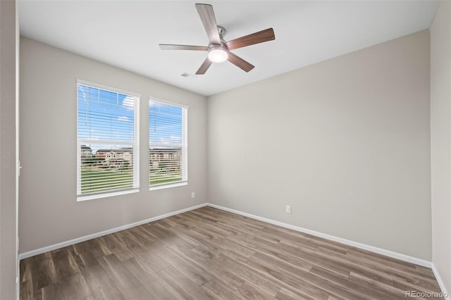 13870 Ash Cir, Brighton, CO 80602 - unfurnished room featuring wood finished floors and a ceiling fan