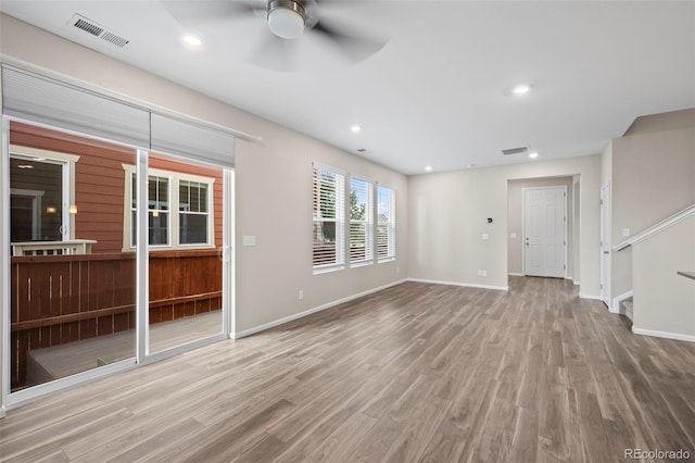 13870 Ash Cir, Brighton, CO 80602 - unfurnished living room with ceiling fan, wood finished floors, recessed lighting, and stairway