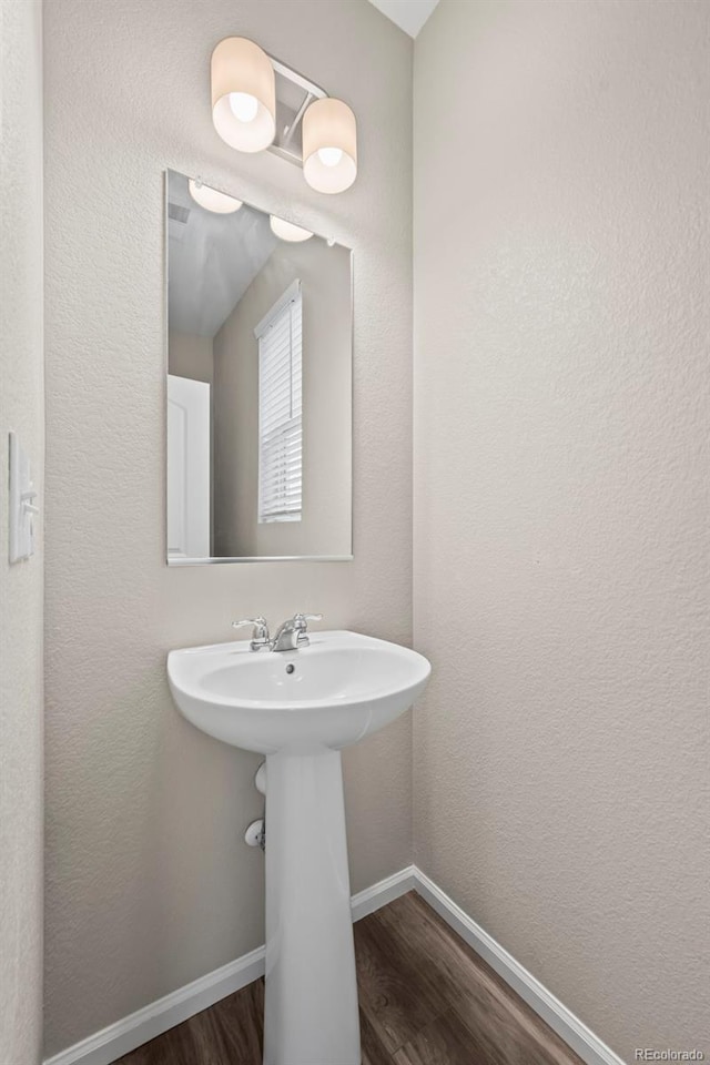 13870 Ash Cir, Brighton, CO 80602 - bathroom with wood finished floors