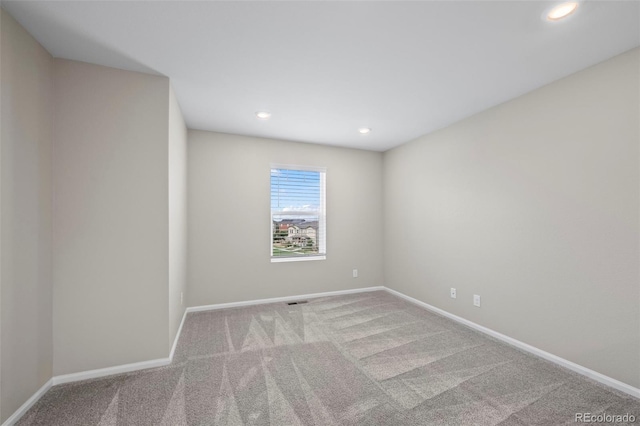 13870 Ash Cir, Brighton, CO 80602 - empty room with carpet and recessed lighting